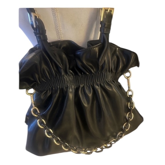 Handbags - Ladies dress black bag. No brand brand new. Never used. NWOT. Black and gold.